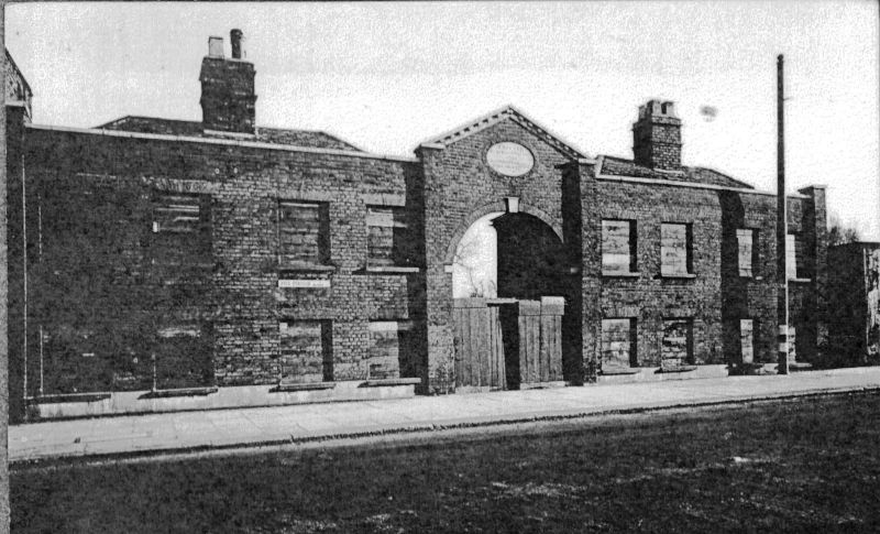 view showing boarded up almshouses