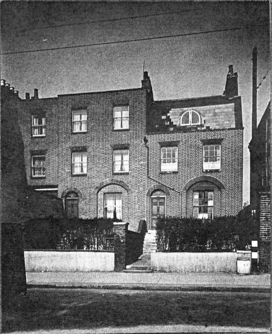 two substantial brick built properties with front gardens