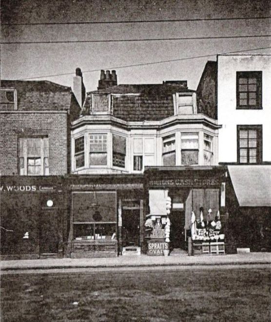 view showing two 3 storey, hip-roofed properties with bay windows on the first floor