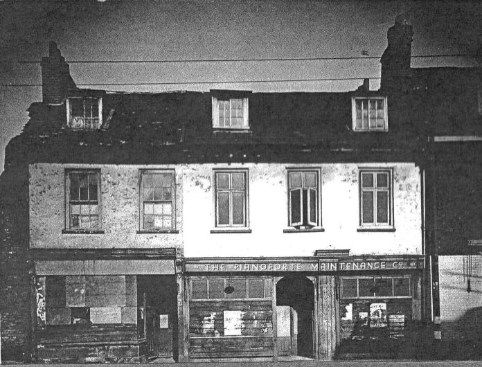 view showing two 3 storey brick built properties