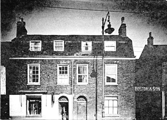 view showing two 2 storey brick built properties with attics