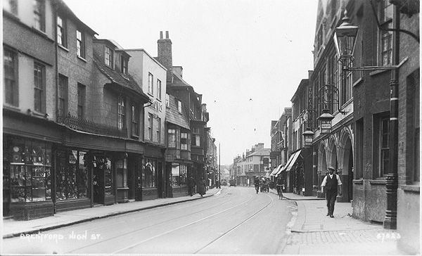 Quiet street scene with cyclists, few pedestrians and distant motor cars