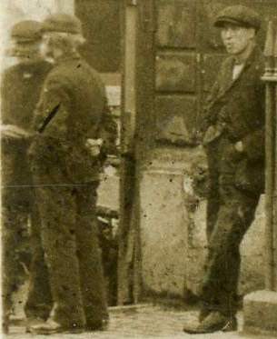 Three men in street