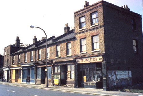 Parade of four two-storey shops with a three storey shop at either end