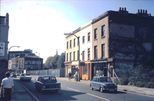 Block of four 3-storey buildings, demolition sites on either side