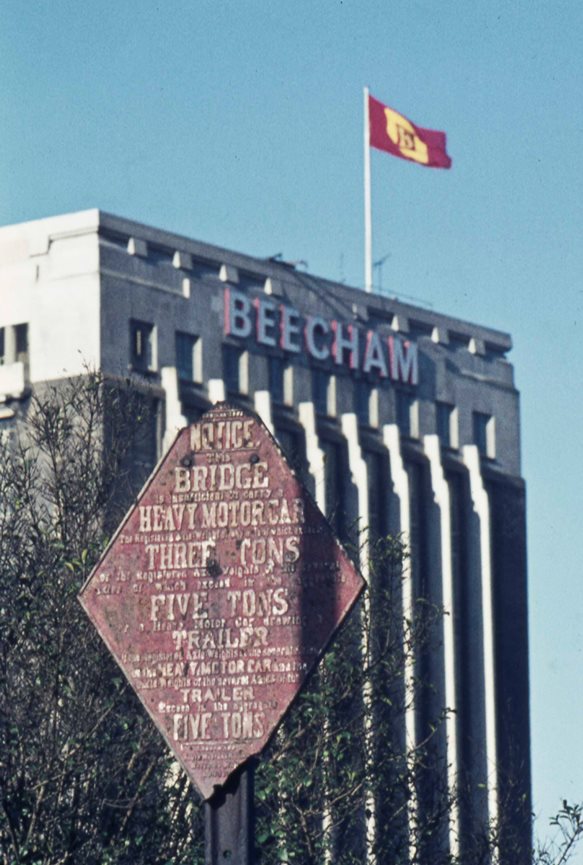 Tower block with road sign in foreground